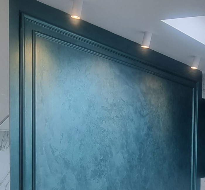 Applied by hand, each wall is a one-of-a-kind design, with options ranging from soft concrete textures to bold metallic and marble effects. 